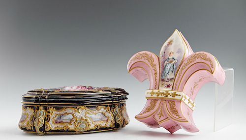 Two French Gilt Decorated Porcelain Dresser Boxes, late 19th c., the pink example of fleur-de-lis form, painted with a lady with flowers in a landscap