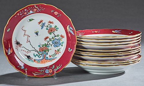 Set of Eleven Japanese Style Meissen Plates, 19th c., the gilt scalloped rims around magenta banding with bird and floral decoration, around a central
