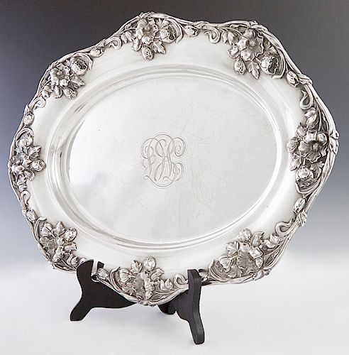 Oval Sterling Serving Platter, late 19th c. By Meriden Britannia Co. , the scalloped rim with relief Art Nouveau flowers, the center monogrammed "TC,"