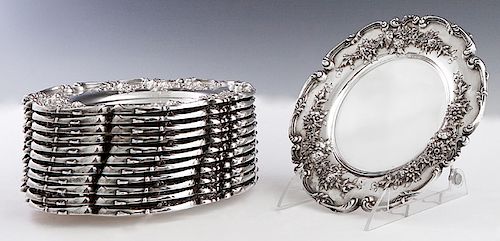 Set of Twelve Sterling Bread Plates, #4532E, the scrolled relief rim around a floral relief border, H.- 1/2 in., Dia.- 7 1/2 in., Wt.- 94.9 Troy Oz. P