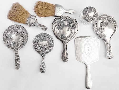 Group of Eight Sterling Dresser Pieces, early 20th c., consisting of a clothes brush by Alvin; a clothes brush by Richard Wallace; a sterling lid crys