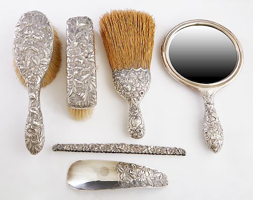 Six Piece Sterling Assembled Dresser Set, early 20th c., consisting of a whisk broom, by Gorham; a shoe horn, hair brush, clothes brush and a hand mir