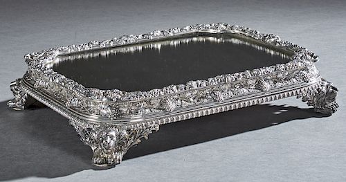 Large English Silverplate Mirror Plateau, early 20th c., the finely chased rectangular top with a relief grape and floral border over stepped ogee sid
