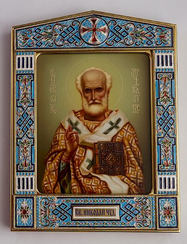 Russian Icon of Saint Nicholas, 20th c., presented in a peaked silver enameled frame, in a conforming mahogany kiot with a beveled glass, H.- 7 3/4 in