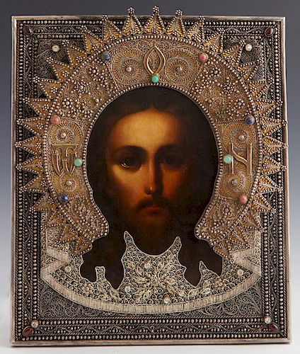 Russian Icon of Jesus' Holy Face, Moscow, 1893, with a gilt silver oklad mounted with semi-precious cabochon stones and faux diamonds, with maker's ma