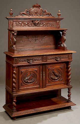 French Henri II Style Carved Oak Marble Top Server, c. 1880, with a pierced medallion crest flanked by lion supports and urn form finials, over an ope