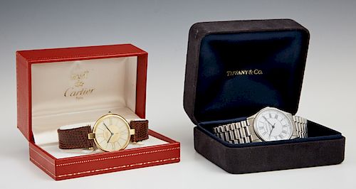 Two Man's Wristwatches, consisting of a Tiffany & Co. "Portfolio" example with a steel link band, in original box; together with a Cartier Quartz exam