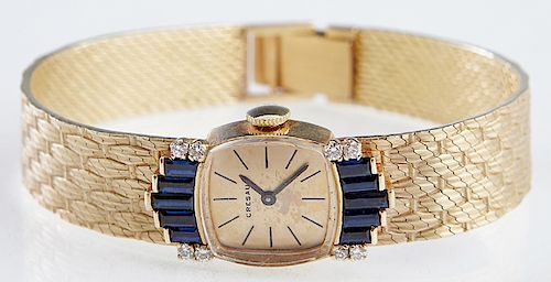Lady's 14K Yellow Gold Art Deco Style Cresaux Wristwatch, 20th c., manual wind, the shaped rectangular face mounted with two diamonds flanking five gr