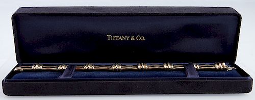 Tiffany and Co. 18K Yellow Gold Link Bracelet, 1995 with eight curved barlinks joined by eight ribbed links, in original black velvet box, H.- 7 in., 