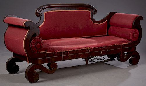 American Empire Revival Carved Mahogany Sofa, late 19th c. the upholstered back with a carved arched scrolled crest rail over cornucopia arms with bol