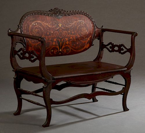Diminutive American Late Victorian Inlaid Mahogany Loveseat, c. 1900, the arched floral and leaf carved crest rail over a back with intricate floral a