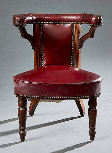 Carved Mahogany and Leather Cockfighting Chair, 19th c., covered in deep red leather with iron tack decoration, H.- 37 in., W.- 23 1/2 in., D.- 24 in.