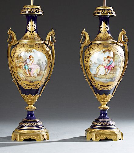 Exceptional Pair of Bronze Ormolu Mounted Cobalt Sevres Porcelain Vases, early 20th c., the sides with gilt bronze ring handles and elaborate applied 