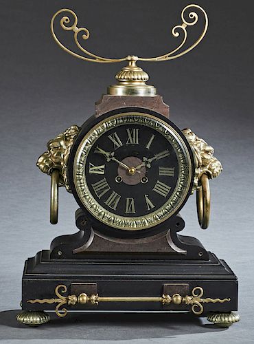Large French Patinated Spelter and Black Marble Mantle Clock, c. 1870, with a scrolled surmount over a large drum time and strike clock with a marble 