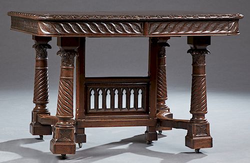 French Gothic Style Carved Oak Dining Table, late 19th c., the carved edge top over a relief carved skirt, on turned twist carved trestle supports on 