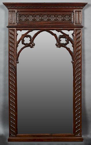 French Carved Oak Gothic Style Over Mantle Mirror, late 19th c., the stepped dentillated crown over a quatrefoil frieze above a Gothic arch and a wide
