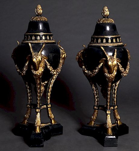 Pair of Louis XVI Style Black Marble and Composition Covered Garniture Urns, 20th c., the lid with a gilt finial to a baluster side with three gilt ra