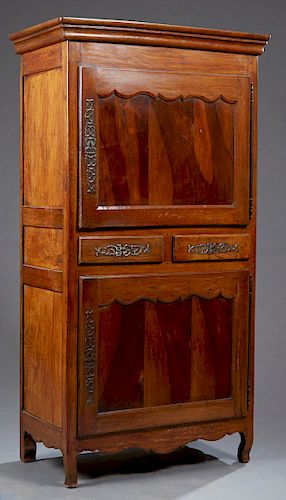 French Provincial Louis XV Style Carved Walnut Homme Debout, 19th c. the stepped crown over a cupboard door with a long steel escutcheon and fiche hin