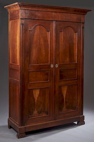 French Provincial Louis Philippe Style Carved Walnut Armoire, 19th c., the stepped ogee crown over two triple paneled doors, flanked by fluted pilaste