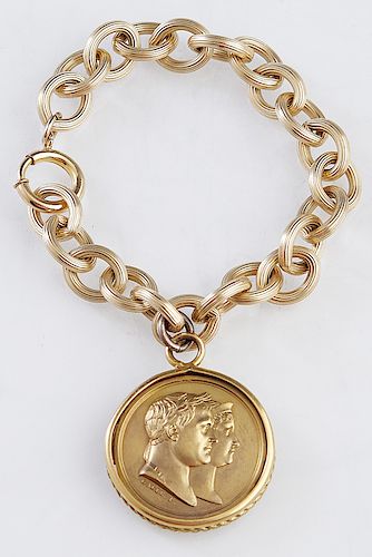 French Gilt Bronze Medal, 1810, commemorating the marriage of Napoleon I to Marie Louise, presented in an 18K yellow gold bezel, suspended from an 18K