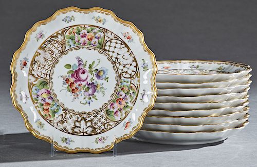 Set of Ten Porcelain Plates, c. 1870, by Helena Wolfsohn, Dresden, the gilt scalloped rims around floral decoration and a gilt banded central floral r