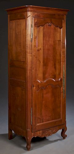 French Louis XV Style Carved Cherry Bonnetiere, 20th c., the rounded edge corner ogee crown over a double arched panel door with steel fiche hinges an
