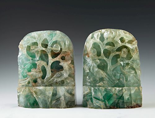 Pair of Oriental Carved Jade Bookends, early 20th c., of arched form, one side with pierced tree carving, H.- 6 1/2 in., W.- 4 1/2 in., D.- 2 in. Prov
