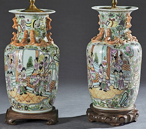Pair of Chinese Famille Rose Porcelain Vases, late 19th c. of baluster form, the everted necks with applied salamander and Foo dog decoration, over si