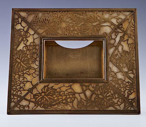 Tiffany Studios Gold Dore Bronze Easel Calendar or Picture Frame Desk Accessory, #940, in the "Grape Vine" pattern with caramel slag glass, signed, "T