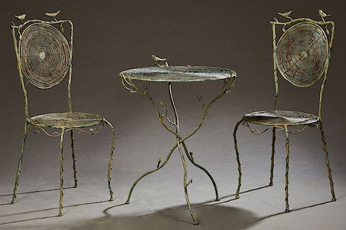 Three Piece Patinated Iron Patio Set, 20th c., consisting of a circular table and a pair of side chairs, the table top and back and seat of the chairs