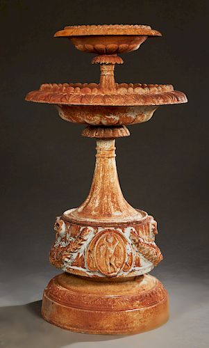 Cast Iron Two Tier Fountain, 20th c., with a lobed circular bowl on a tapered fluted support to a larger like bowl on a tapered support to a base with