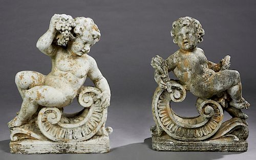 Two Cast Stone Figures of Putti, 20th c., representing two of the four seasons, seated on large scrolls on plinth base, H.- 31 in., W.- 23 in., D.- 12