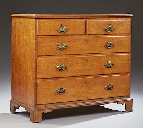 English Georgian Carved Mahogany Chest, 19th c., the rectangular top over two frieze drawers above three graduated long drawers, all with oval palmett