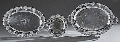 Group of Three Silverplated Serving Trays, with relief grape and leaf motif borders, consisting of one handled example by Barbour Co.; a circular Engl