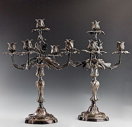 Pair of Silverplated on Brass Louis XV Style Five Light Candelabra, 20th c., the five relief decorated arms with relief candle cups and leaf form bobe