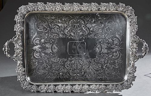 Large English Silverplated Serving Tray, 19th c., marked "Sheffield Silver on Copper," with a wide relief grape bunch and leaf border around a scroll 