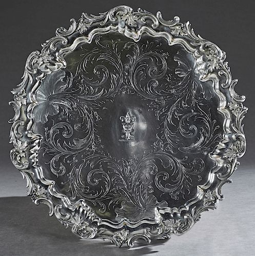 English Silverplated Circular Serving Tray, 19th c., Sheffield, with a relief scroll and leaf border around a scroll and leaf engraved interior, with 
