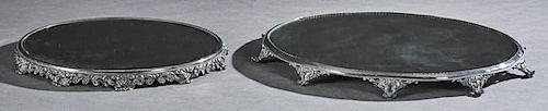 Two American Silver Plated Circular Mirror Plateaus, early 20th c., the smaller with a beveled mirror over a pierced relief scrolled border, on eleven