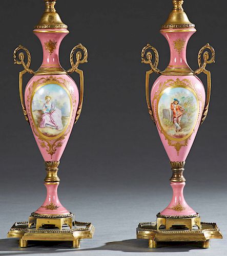 Pair of Bronze Mounted Sevres Style Bronze Ormolu Mounted Pink Porcelain Lamps, early 20th c., of baluster form, with ormolu handles, one with a reser