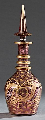 Large Vintage Murano Cranberry Glass Decanter and Stopper, 20th c., with gilt, enamel and cut decoration, with a tall spire stopper, H.- 21 in., Dia.-