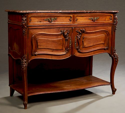 French Louis XV Style Carved Oak Marble Top Sideboard, late 19th c., the serpentine rounded corner highly figured rouge marble over two frieze drawers