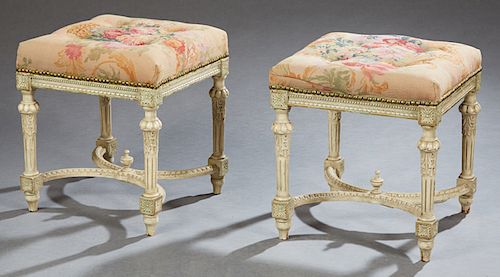 Pair of Louis XVI Style Polychromed Stools, early 20th c., the tufted floral petit point cushions with iron tack decoration, on a carved skirt, to tur