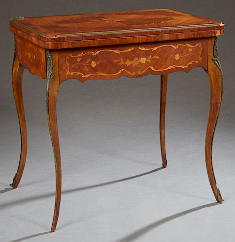 Louis XV Style Ormolu Mounted Marquetry Inlaid Games Table, early 20th c., the brass banded top swiveling to a baize lined interior, over serpentine s