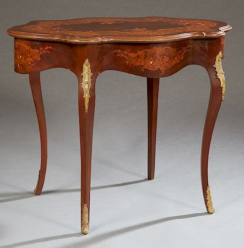 Continental Louis XV Style Marquetry and Mother-of-Pearl Inlaid Ormolu Mounted Mahogany Center Table, c. 1900, the turtle shaped top over a conforming