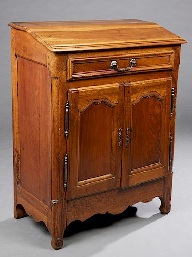 French Louis XV Style Carved Oak Slant Lid Desk, 18th c., the hinged slant lid over open storage, above a frieze drawer and a shaped panel door with s