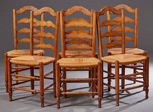 Set of Six French Provincial Carved Cherry Rushseat Ladderback Dining Chairs, late 19th c., the curved four splat back over a trapezoidal rush seat, o
