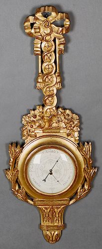 French Louis XVI Style Gilt and Gesso Carved Pine Barometer, 19th c., the bow surmount over a pierced twisted floral support, to a relief floral base,