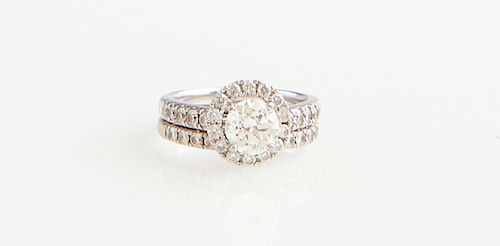 14K White Gold Engagement Ring, with a round 1.23 carat diamond, atop a border of small round diamonds, the shoulders mounted with graduated round dia