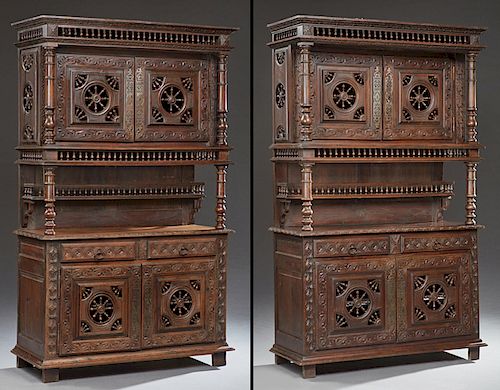 Rare Pair of French Provincial Carved Oak Buffets a Deux Corps, 19th c., Brittany, the stepped crown over a spindle gallery above double setback spind