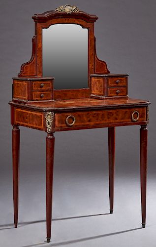 French Louis XVI Style Inlaid Ormolu Mounted Burled Walnut Dressing Table, early 20th c., the arched beveled mirror with an ormolu crest, flanked by t